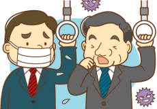 電車のつり革につかまる二人の男性